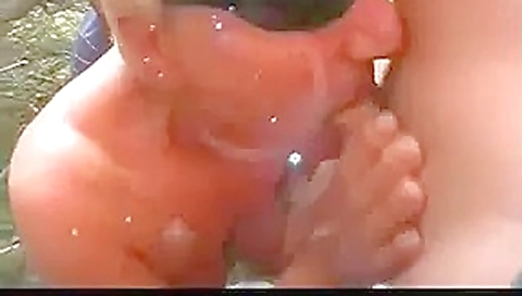 Granny engulfing even more cock at the beach