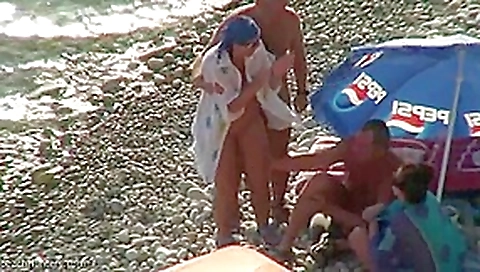Real swingers at a nudist beach Real swingers at a nudist beach