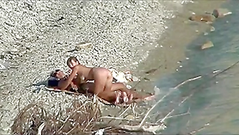 Couple fucking on a public beach, while walking past people Couple fucking on a public beach, while walking past people