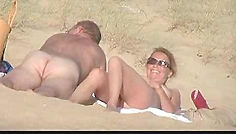 Hot amateurs enjoying sex on a sandy public beach